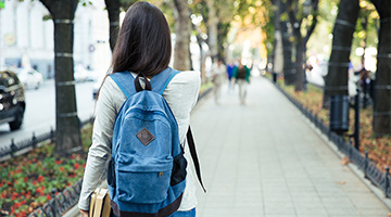 Student walking down street